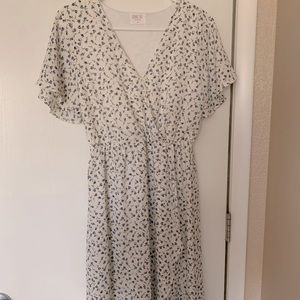 Mid-length blue/white floral dress.